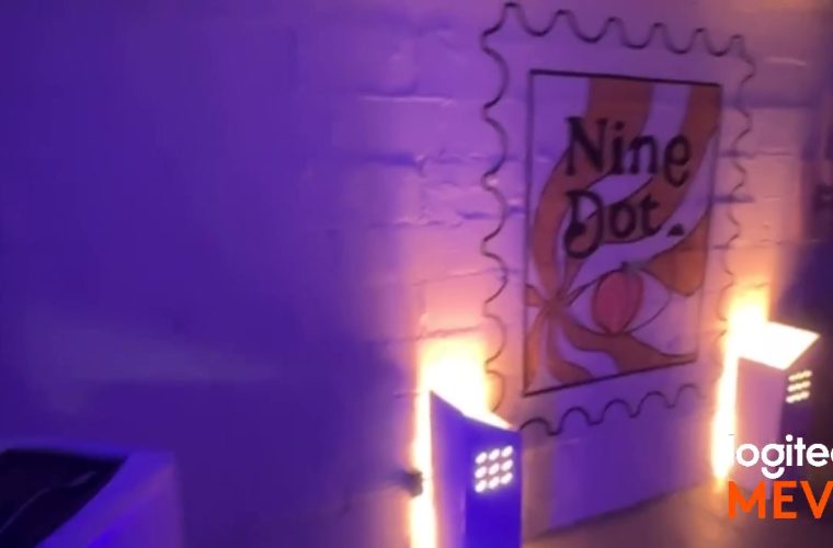 Nine Dot event sign and DJ setup